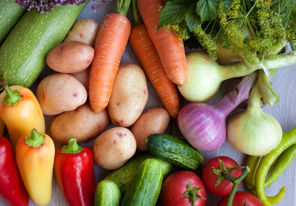 Close up of various colorful fresh raw vegetables. Flat lay. On black wooden table. Royalty Free Stock Images