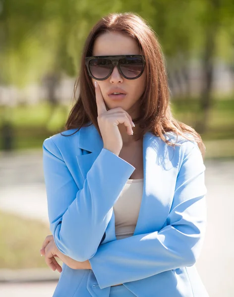 woman with full lips in summer street. pretty girl portrait. Spring time. City street fashion