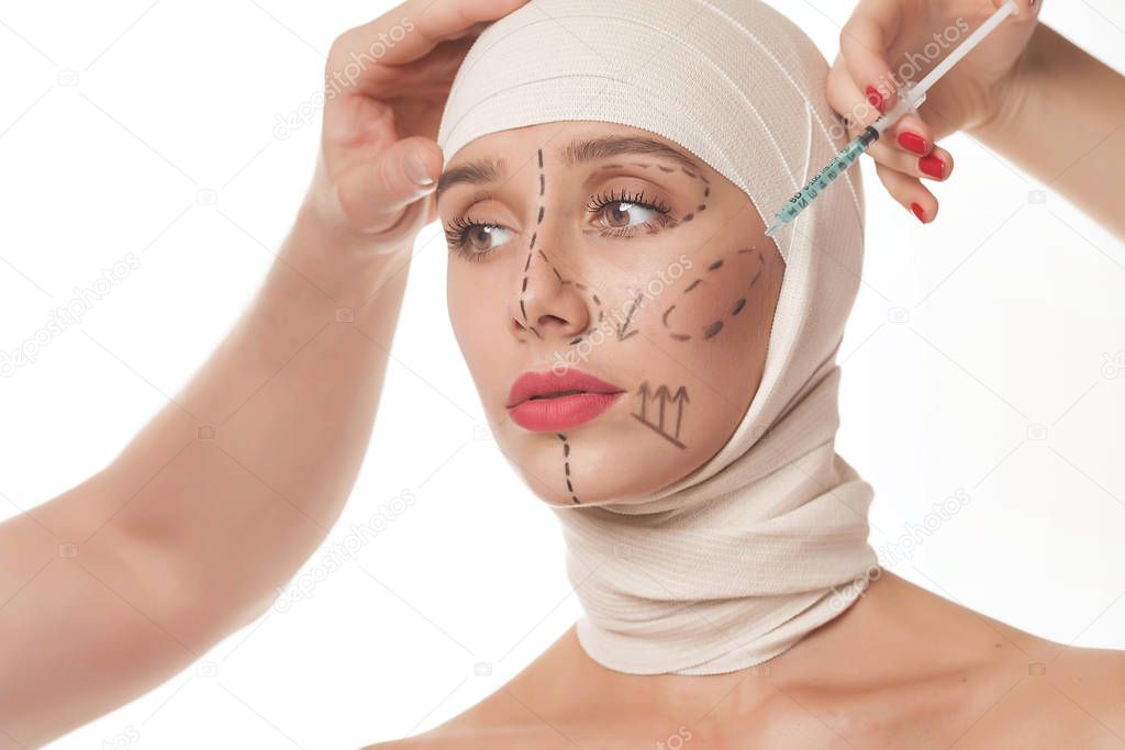 Woman gets cosmetic injection. Beautiful woman after plastic surgery with bandaged face. Beauty, and Plastic Surgery concept