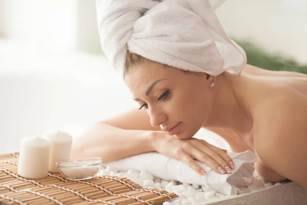 portrait of young beautiful woman in spa environment