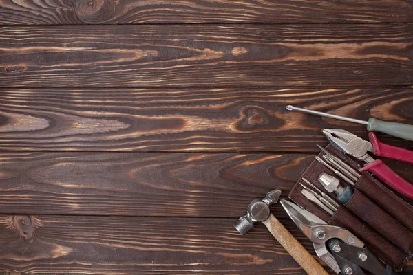 Close up tools on a wooden background