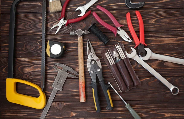 Close up tools on a wooden background