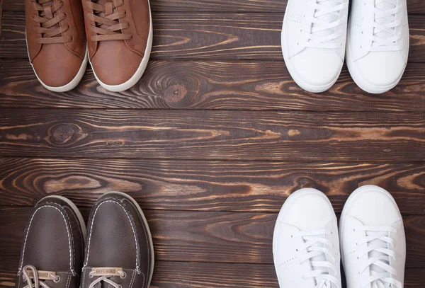 Various Pairs Colorful Sneakers Laid Wooden Floor Background — Stock Photo, Image