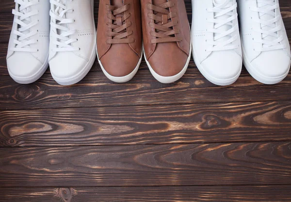 Various Pairs Colorful Sneakers Laid Wooden Floor Background — Stock Photo, Image