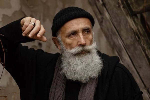 Outdoor Portrait Of Stylish Old Smiling Man With Long Grey Hipster Beard  by Stocksy Contributor VISUALSPECTRUM - Stocksy