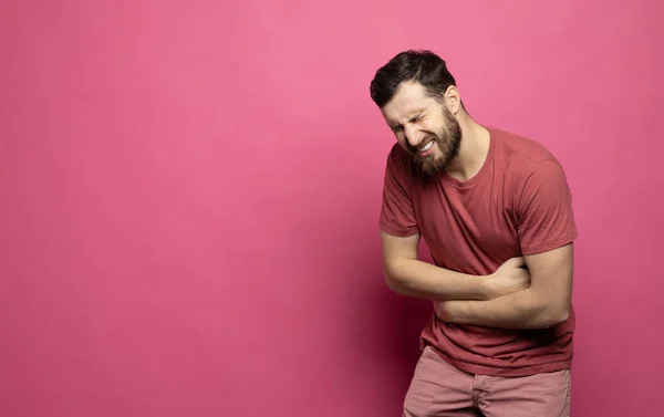 Young Bearded Man Suffering Stomach Ache Pink Background — Stok fotoğraf