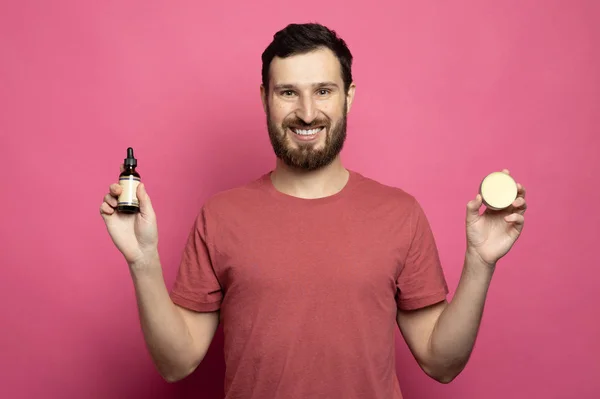 Close Image Handsome Bearded Man Holding Beard Balm Oil Pink — Stok fotoğraf