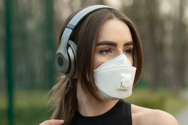 Flu virus protection mask protective against influenza sickness viruses and disease. Sick woman wearing  face mask in public spaces. Healthcare  concept. Corona virus. Covid-19.