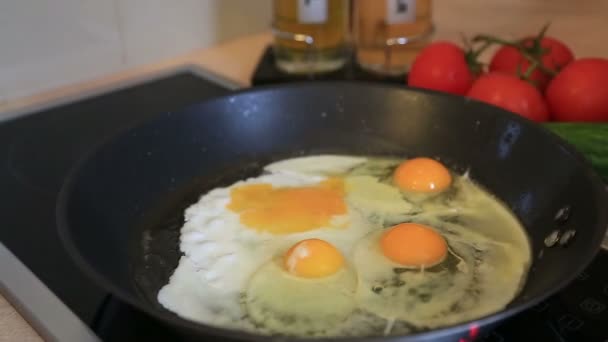 Four broken egg in a frying pan 2 — Stock Video