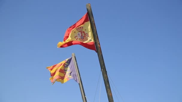 Spain and Valencia flags at the blue sky — Stock Video