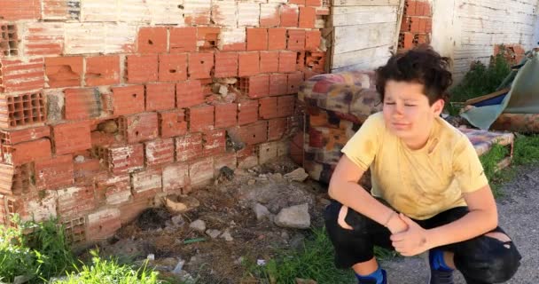 Portrait Caucasian Poor Young Boy Infront Slum Looking Sadly — Stock Video