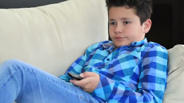 Portrait Young Preteen Boy Remote Controller Lying Sofa Watching Television — Stock Video