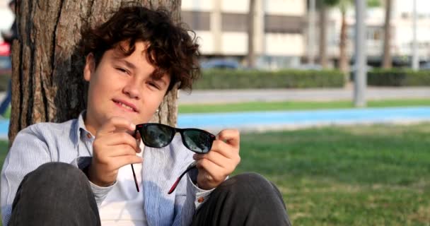 Portrait One Teenage Boy Sitting Cittiy Park Looking Camera Smiling — Stock Video