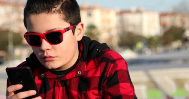 Portrait Handsome Teen Boy Sitting Skate Park Alone Kid Watching — Stock Video