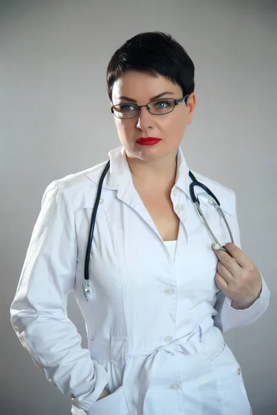 Portrait of cheerful happy doctor in hospital. Friendly female doctor.