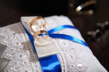 Gold wedding rings. Gold wedding rings on a decorative pillow