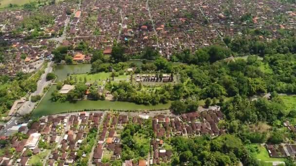 Aerial view in Bali Indonesia : Long. orderly row of structures with tiered. — Stock Video