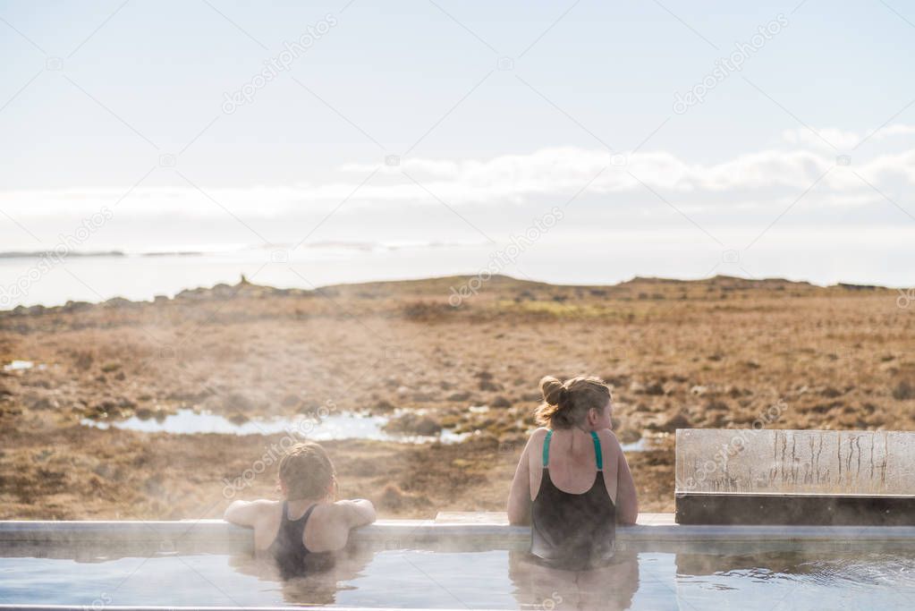 Icelandic hotpot among the amazing lagoon and mountains