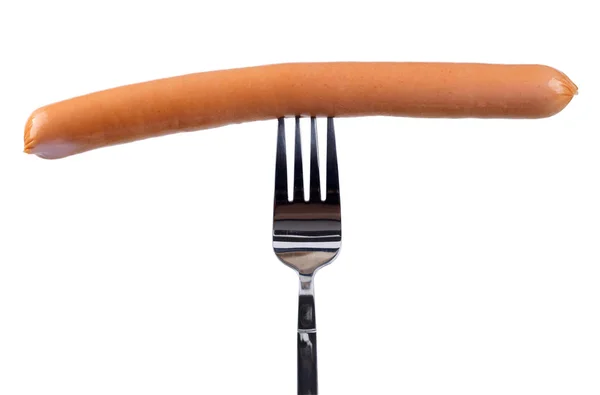 在孤立的叉子上美味的法兰克福香肠 — 图库照片