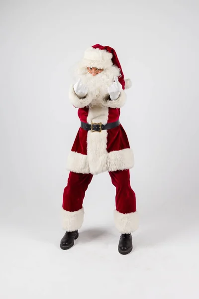 Santa Claus in eyeglasses and red costume make a point with a hands on white background and looking into camera. — Stock Photo, Image