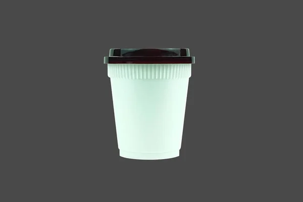 Белая пластиковая чашка кофе на сером фоне . — стоковое фото