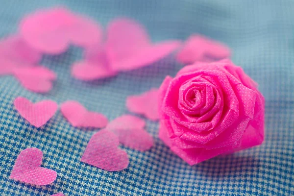 Pink rose and small hart on blue cloth background for Valentine — Stock Photo, Image