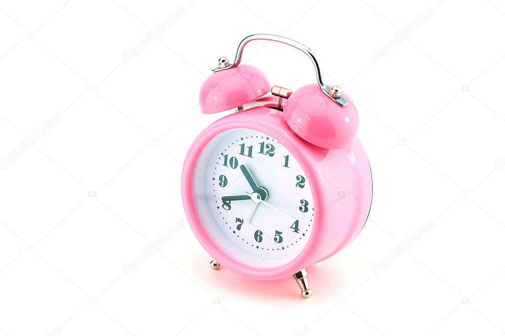 Pink color alarm clock side view isolated white background,