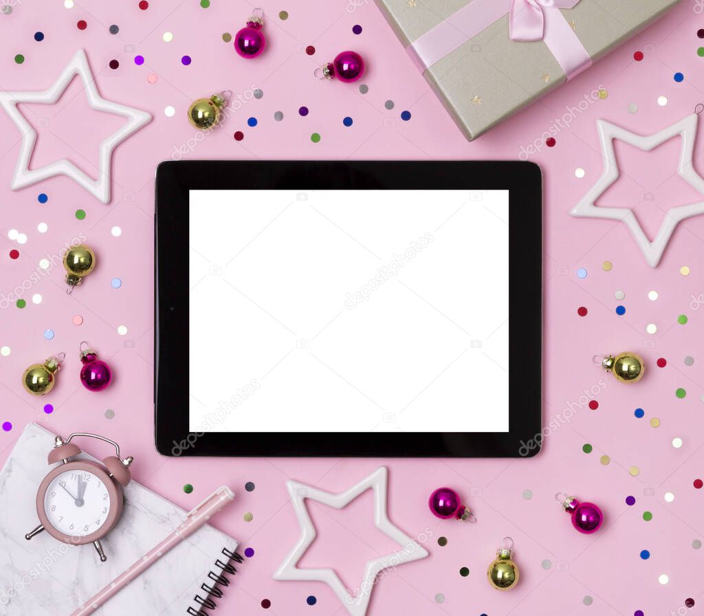 Marble notepad with pen, gift and ornaments on pink background