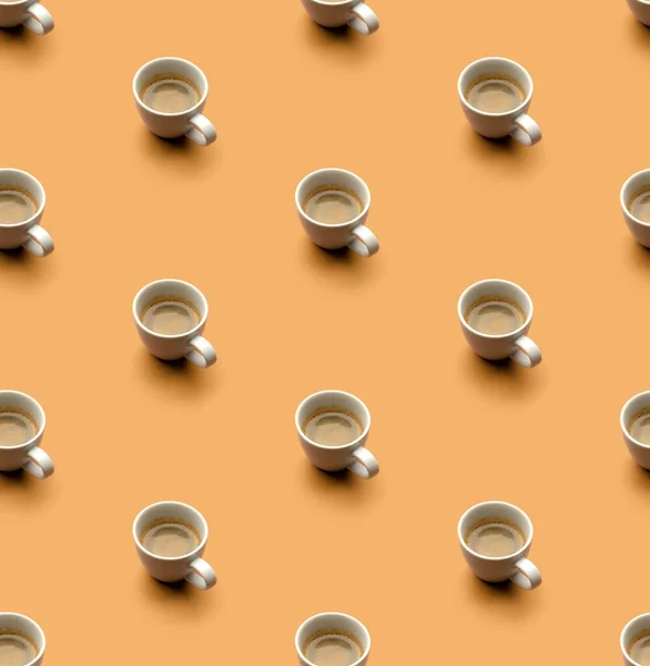 Coffee pattern with white espresso cup on beige. Pop art minimal flat lay creative composition. Morning breakfast background