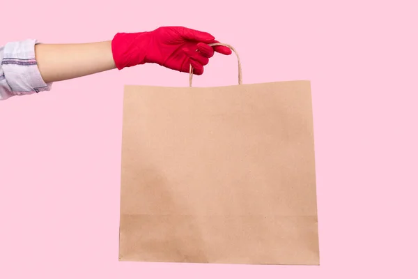 Womans Hand Rubber Glove Holding Paper Bag Pink Background Stay — Stock Photo, Image