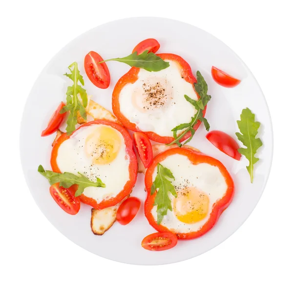 Huevos en pimienta en un plato — Foto de Stock