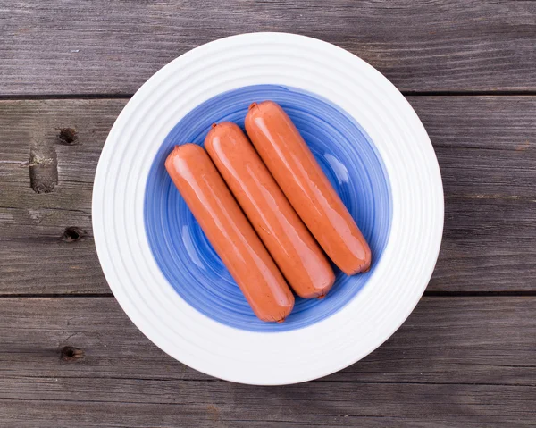 Sausages fresh in a plate Stock Image