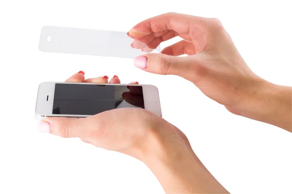 Installation of protective glass on the smartphone Stock Image