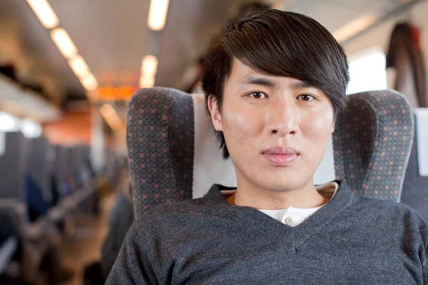 asian young man in the subway station