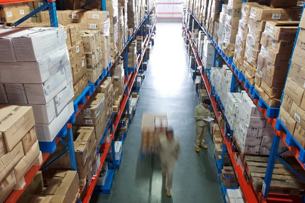 warehouse shelves with boxes in the background