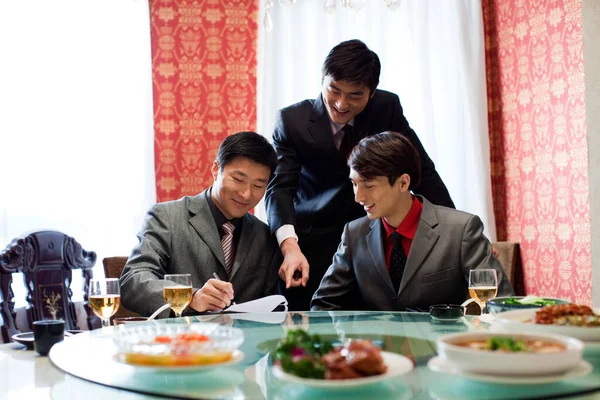 couple of business people having dinner in restaurant