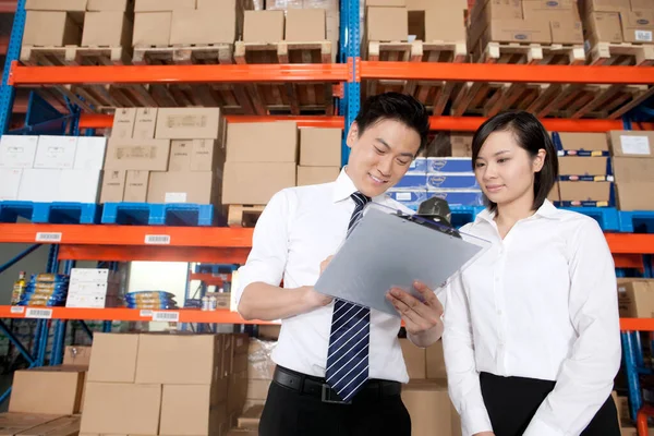 young asian business people working in the warehouse