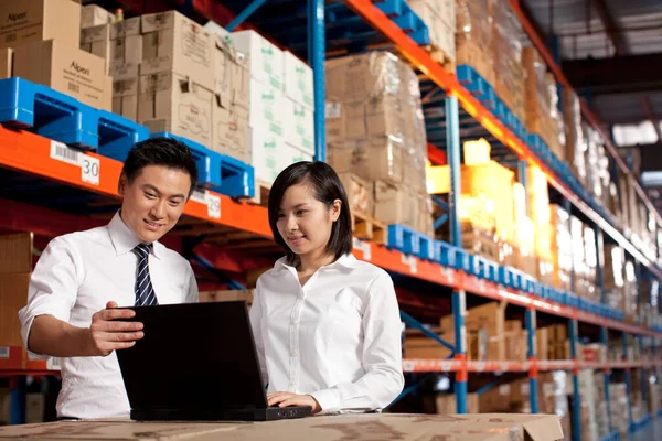 asian business people working in warehouse, logistic and transportation concept