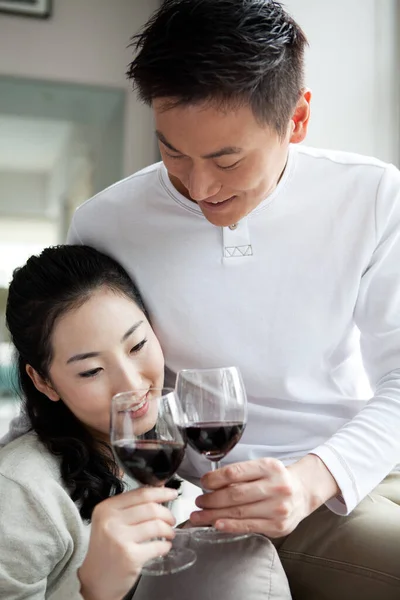 couple drinking wine and smiling