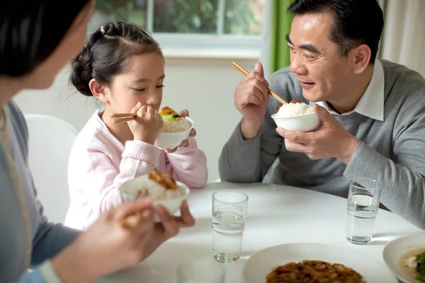 family eating lunch together at home