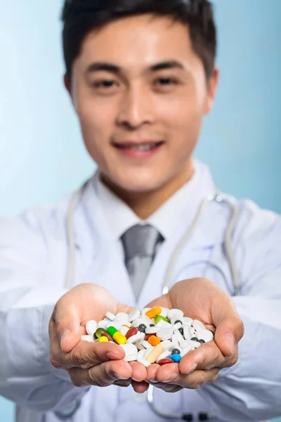 young man with pills in his hands