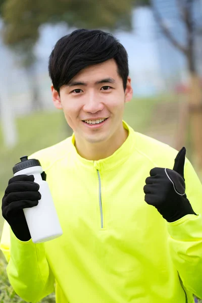 young man with a green shirt and a white t-shirts