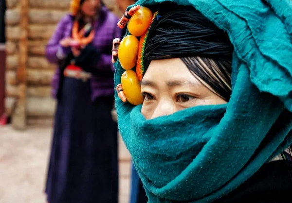 a woman in a mask and a scarf with a protective face masks.