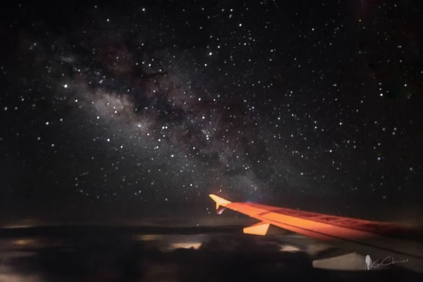 airplane flying in the night sky
