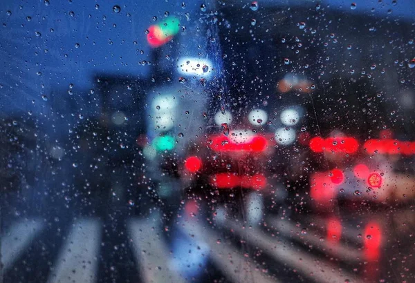 blurred view of car window with cars