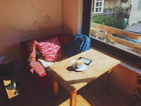 interior of a cafe with a coffee cup and a chair
