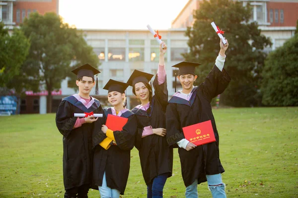 group of students with graduation hats and diploma