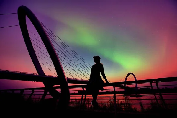silhouette of a man on the bridge