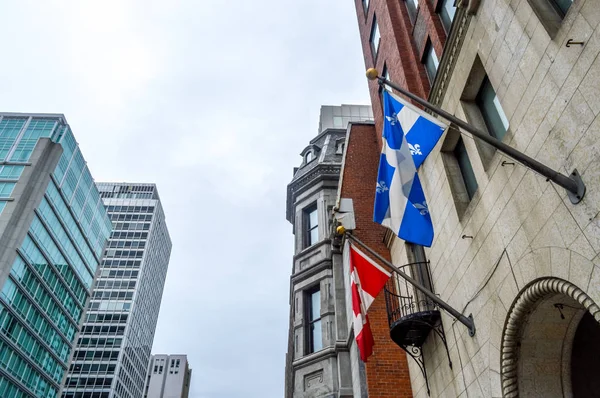 National and Quebec flags on display in Montreal City