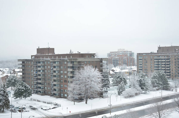 Condo buildings in snow in Montreal downtown in winter time